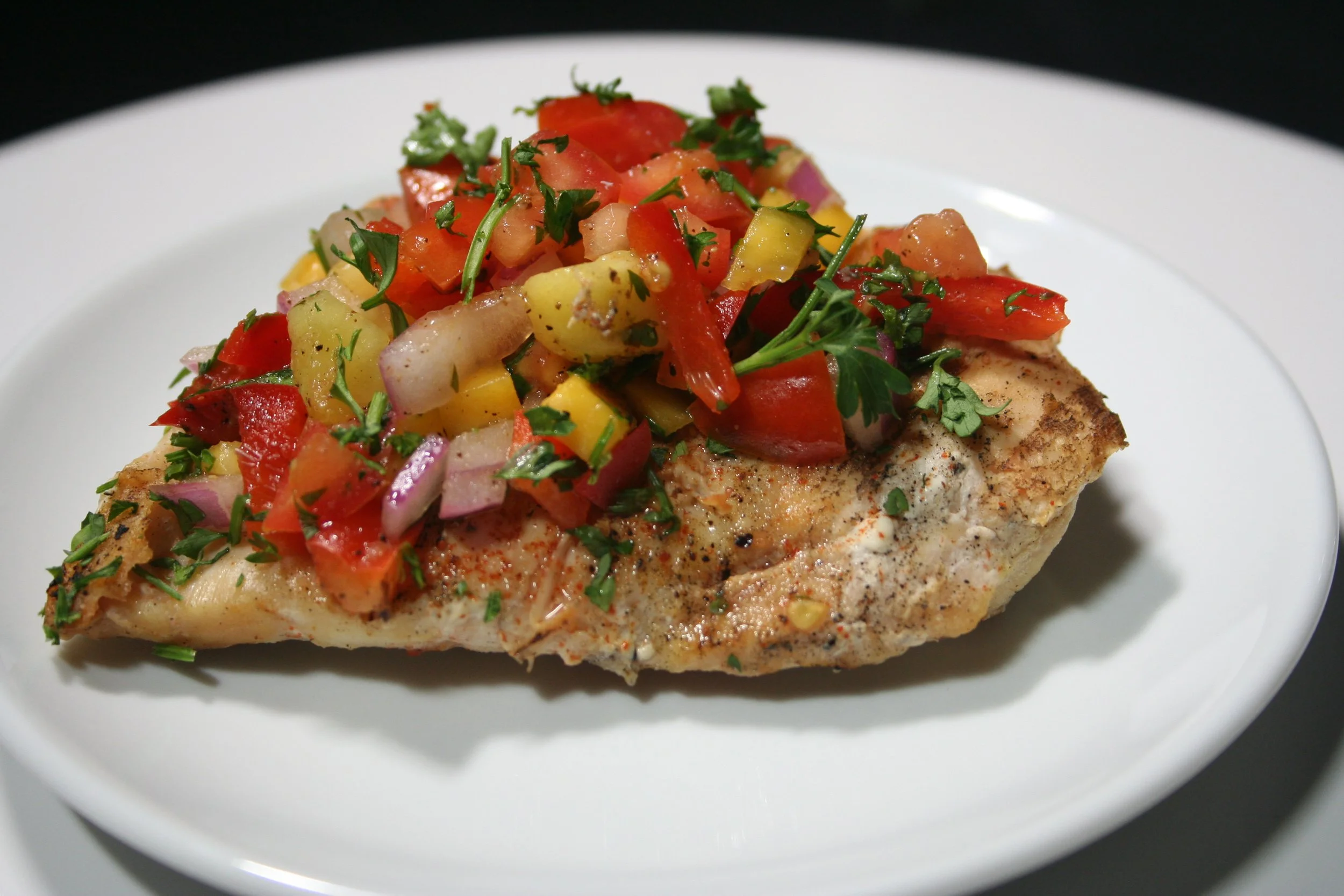 Riviera chicken entrée with colorful garnish